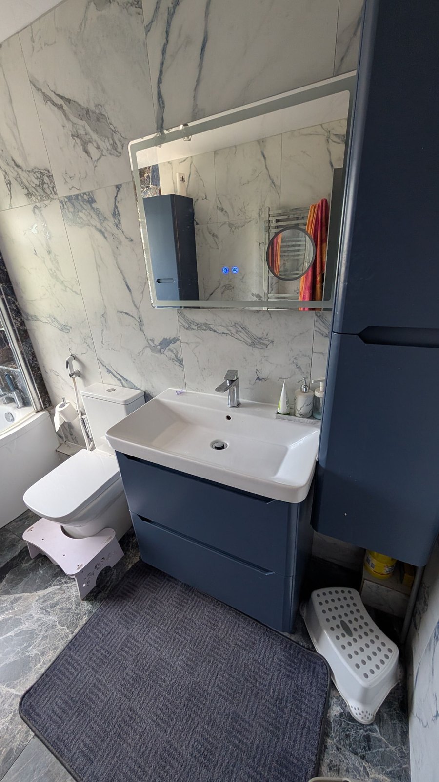 Clean bathroom vanity, basin, mirror and toilet after a Preshine clean